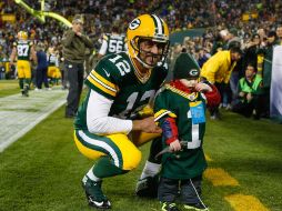 Rodgers alcanzó una nueva marca en la NFL al realizar seis pases de touchdown. AFP / T. Lynn