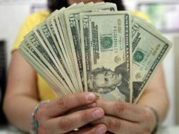 En la categoría interbancaria el peso se aprecia en 13.51 unidades respecto a los 13.62 del cierre de la jornada anterior. EL INFORMADOR / ARCHIVO