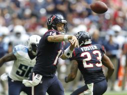 Ryan Fitzpatrick logra un nuevo récord para la franquicia con seis pases de touchdown, vuelve a la titularidad tras lesión de Mallet. AFP / B. Levey