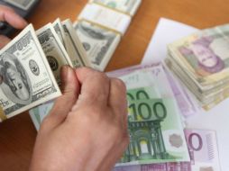 Se mantiene la expectativa de un dólar fuerte ante a sus principales cruces y a las monedas de economías emergentes. AFP / ARCHIVO