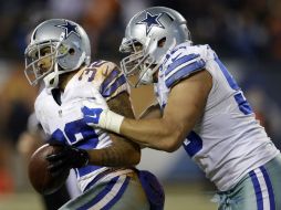 Orlando Scandrick (i) celebra con Tyrone Crawford la intercepción que consiguió en la segunda mitad del juego. AP / N. Huh
