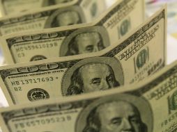 El tipo de cambio para solventar obligaciones en moneda extranjera pagaderas en el país es de 14.3674 pesos. EL INFORMADOR / ARCHIVO