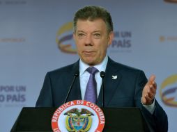 Santos afirma que no pueden repetir errores del pasado y que su deber es garantizar la seguridad del pueblo. EFE / J. Casella