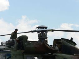 Equipos de búsqueda y rescate continúan los trabajos para localizar más cuerpos de las víctimas. AFP /