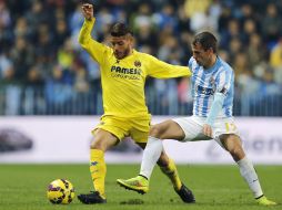 'Jona' (i) anota en la primera mitad del encuentro, pero el Málaga iguala el marcador al minuto 60. EFE / J. Zapata