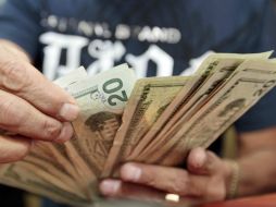 El tipo de cambio para solventar obligaciones en moneda extranjera pagaderas en el país en 14.7548 pesos. EL INFORMADOR / ARCHIVO