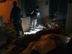 Según las fuentes, el olor fétido producido por los cuerpos llamó la atención de los vecinos de esa zona. AFP /