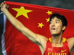 Xiang ganó oro en Atenas 2004 y entró en la historia del atletismo chino. AFP / ARCHIVO