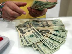 El tipo de cambio para solventar obligaciones denominadas en moneda extranjera es de 15.4845 pesos. EL INFORMADOR / ARCHIVO