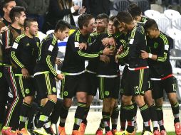 El equipo mexicano festeja la victoria ante Uruguay en el Mundial Sub-20 en Nueva Zelanda. AFP / M. MELVILLE