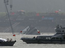 Más de 200 buzos están trabajando en las aguas del Yangtsé en tres turnos para registrar las cabinas de la embarcación una a una. AP / A. Wong