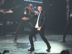 El astro de Puerto Rico, arropado por ocho bailarines e igual número de músicos más un corista, en el Auditorio Telmex. EL INFORMADOR / F. ATILANO