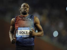 Usain Bolt intentará defender su cetro en 100 metros planos. AFP / ARCHIVO