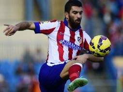 Arda Turan ha jugado las últimas cuatro temporadas en el Atlético de Madrid, con un total de 178 partidos, 22 goles y cinco títulos. AFP / ARCHIVO