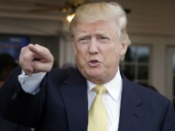 ''Tengo muchos migrantes legales que trabajan conmigo. Ellos me aman y a mí me encantan'', dice Trump. AP / S. Wenig