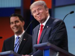 La mayoría de los candidatos en el escenario evitaron discutir directamente con Trump en el debate. AFP / M. Ngan