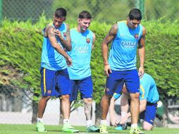 De lujo. (De izq. a der.) Neymar, Lionel Messi y Luis Suárez ayer durante el entrenamiento del Barcelona. EFE / T. ALBIR