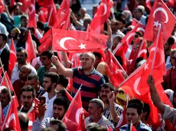 La movilización se efectuó bajo una fuerte vigilancia policial que incluyó francotiradores y cacheos en las entradas. AFP / O. Kose