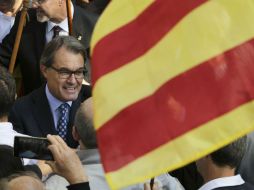 Mas estuvo acompañado de miles de personas que le aclamaron. AFP / P. Barrena