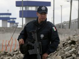 El defensor de los uniformados señala que los monitores que éstos operaban ''no tenían audio, porque eso sería una romería''. AP / ARCHIVO