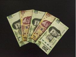 El peso inicia la sesión con una apreciación moderada de 0.07 por ciento, al cotizar alrededor de 16.75 pesos por dólar. EL INFORMADOR / ARCHIVO