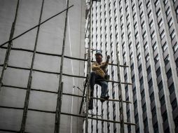 Las fábricas en China están cerrando masivamente sin pagar a sus empleados indemnizaciones u otra compensación por su despido. AFP / P. López