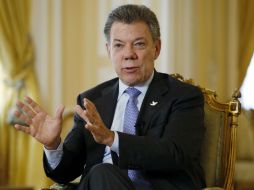 Santos sostiene que si las FARC aceptan el acuerdo de paz, EU debería sacarlos de la lista terrorista donde incluye al EI y Al Qaeda. AP / F. Vergara