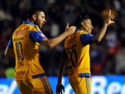 André-Pierre Gignac, sumó siete dianas, y Javier Aquino, hizo el gol del empate para los felinos. AFP / M. Calls