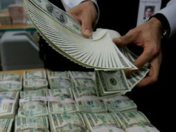 Consideran que podrá oscilar en un rango de entre 17.41 y 17.48 pesos. AFP / ARCHIVO