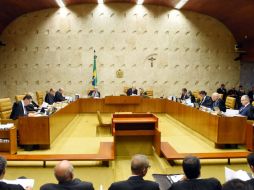 La sesión empieza con la lectura del acta por el secretario de la Cámara. AFP / E. Sa