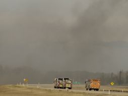 Bomberos habían estimado que el fuego saliera de control unos dos mil km2 al este de la ciudad. AP / R. La Corte