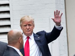 El magnate se niega a revelar lo que paga de impuestos cuando un periodista le pregunta el porcentaje que paga por sus ingresos. AFP / B. Smialowski