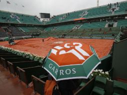 Las precipitaciones anunciadas en la región de París hasta la tarde obligaron al aplazamiento de todos los partidos. AP / M. Euler