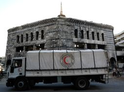 Un total de 31 camiones con comida para 14 mil 200 familias accedieron al lugar, de parte de la Cruz Roja y la Media Luna Roja Siria. AFP / S. Al-Doumy
