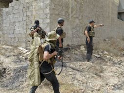Ayer, las fuerzas del Ejército iraquí liberaron las poblaciones de Farach y Jarba Shaman. AP /