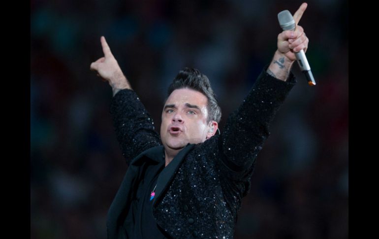 Luego de 15 años de éxito como solista, Robbie volvió a juntarse con la formación para editar 'Progress'. AFP / ARCHIVO