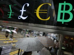 Al cierre del 27 de junio, el monto repatriado de capitales en el extranjero fue de 534 millones 398 mil 293 pesos. AP / K. Cheung