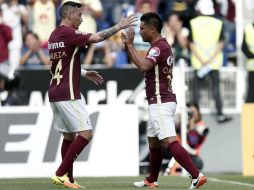 Rubens junto a Osvaldito en el partido en contra de Puebla. EFE / H.Ortuno