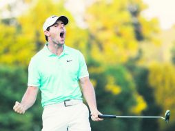 Rory McIlroy celebra a todo pulmón la obtención del premio mayor de la temporada, ayer tras cuatro hoyos de desempate. AFP /