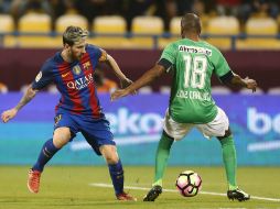 El partido formaba parte de los compromisos de patrocinio del Barça con Qatar Airways. AFP / K. Jaafar