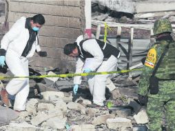 Incertidumbre. Autoridades reconocieron ayer que existía una docena de desaparecidos tras la explosión. EFE /