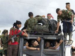 Mauricio Lizcano enfatizó que 'cinco mil 700 guerrilleros comenzarán a bajar del monte y entregar sus armas'. AP / ARCHIVO