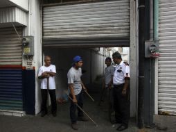 Los primeros cierres de locales se registraron en el mercado Unidad Veracruzana, donde se dio la alarma de un saqueo. AP / F. Marquez