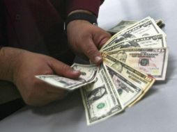 Se estima que el tipo de cambio cotice este miércoles entre 21.25 y 21.55 pesos por dólar. NTX / ARCHIVO