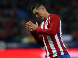El ''Niño'' Torres celebra la diana que le da la victoria al equipo de la capital española. AFP / C. Manso