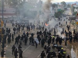 La CNDH detalla una deficiente revisión por parte del notario, quien sólo reportó que policías no llevaban armas. AP / ARCHIVO