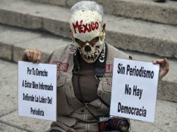 Pidieron seguridad para las familias de las víctimas y para los reporteros que hoy están amenazados por ejercer su profesión. AFP / A. Estrella