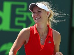 Caroline Wozniacki festeja la obtención de un punto en su partido de ayer. AFP / A. Bello