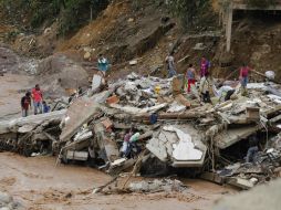 Juan Manuel Santos regresó este domingo a la zona del desastre para dirigir las operaciones. AP / F. Vergara