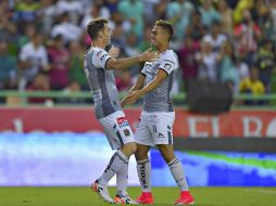 Jugadores del León celebran su triunfo ante Puebla. MEXSPORT / I. Ortiz